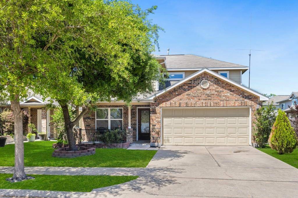 Stunning curb appeal with a well-maintained front yard and charming architectural details.