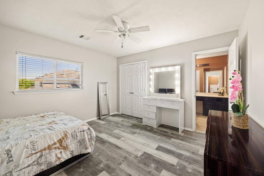 Secondary bedroom upstairs with separate entrance to a shared bathroom.