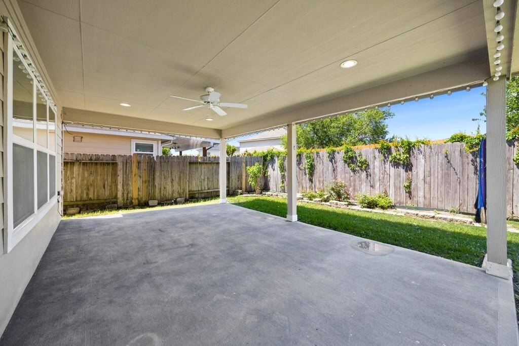 Oversized covered patio ideal for entertaining or relaxing in the shade.