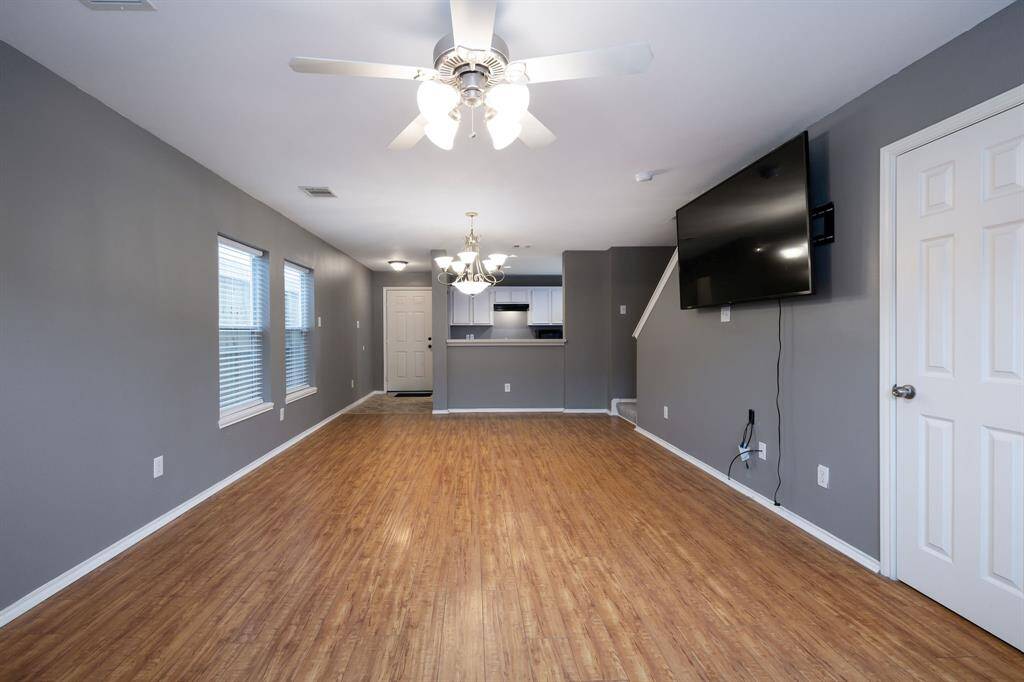 Laminate flooring makes cleaning a breeze! Powder room in the door to right. Garage is behind the camera.