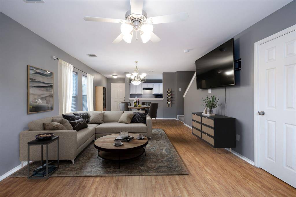 Garage entrance is around the corner to the left. Large windows allow for lots of natural light. 2" blinds finish add a nice touch.