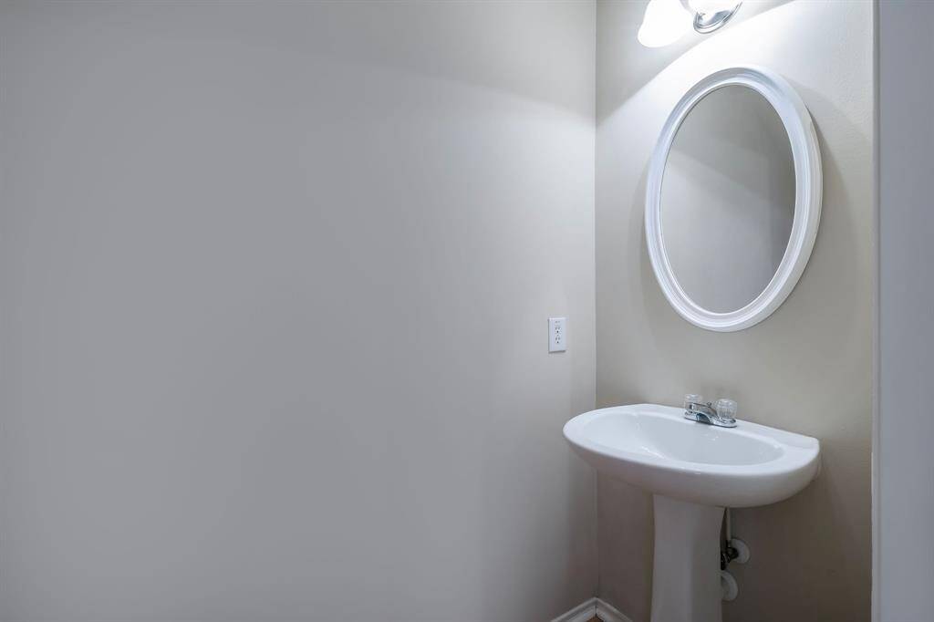 Just up the stairs, you will find the laundry room, complete with washer and dryer. The secondary bathroom is straight ahead just passed the secondary bedroom.