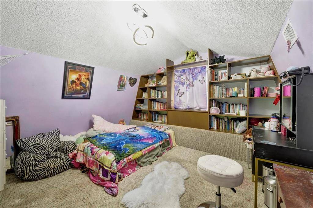 Oversized game room with plenty of room for storage also.