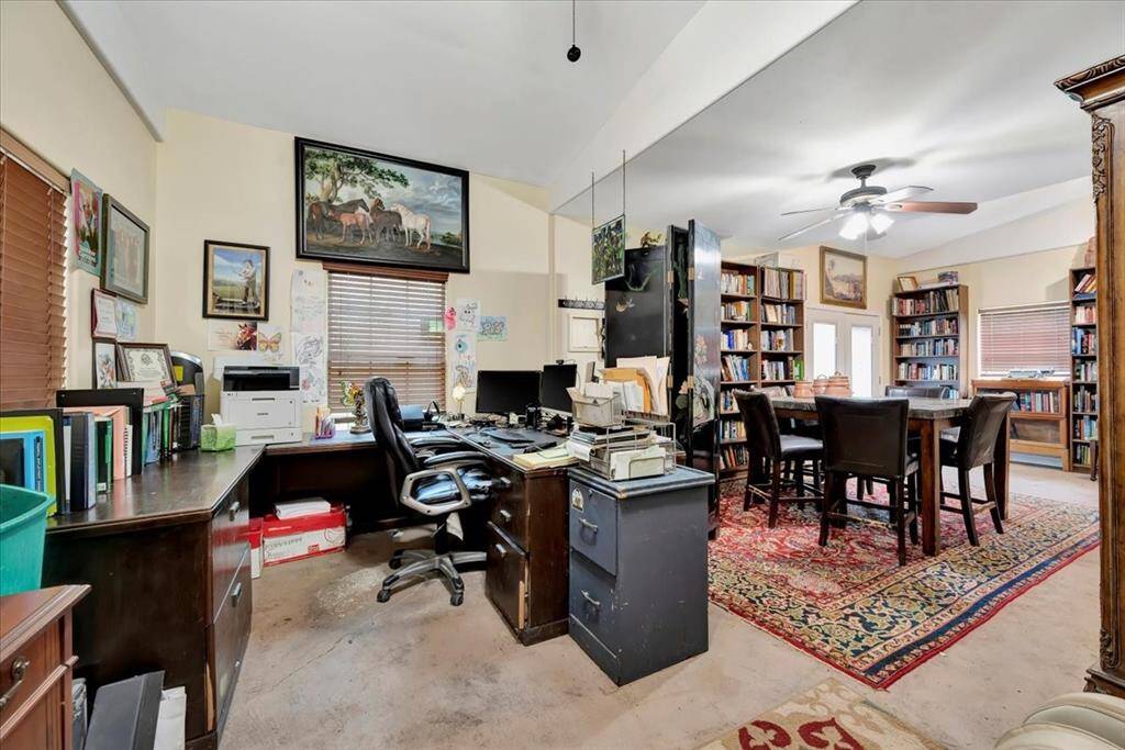 Insulated pool house run with electricity, perfect place for poolside lounging or additional entertainment space.