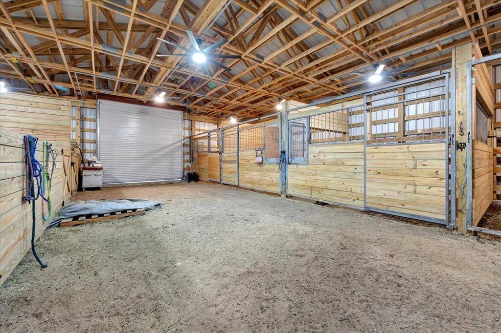 Extra wide for trailers, ceiling fans and lights in every stall.