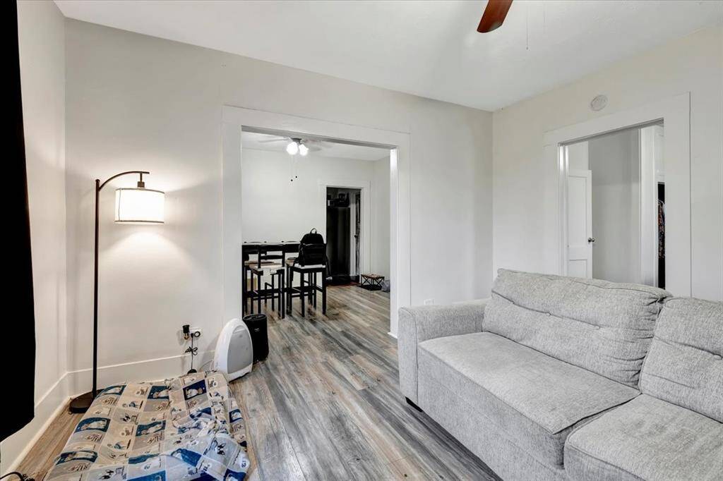 Living room flows to the dining room kitchen and 1 of the bedrooms.