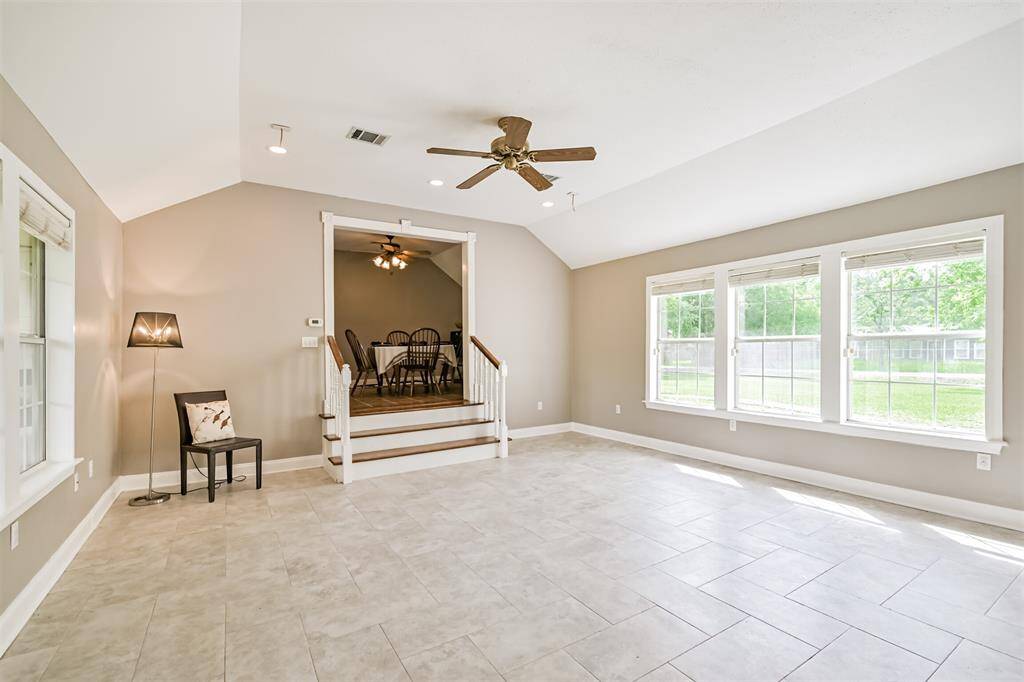A stunning addition to the original home, this spacious family room offers an airy retreat perfect for relaxing or entertaining, just a few steps from the breakfast area.