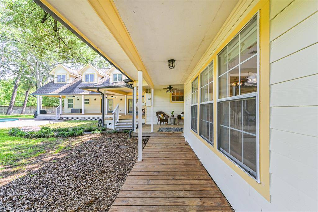 Located just off the breakfast room, dining room, and gameroom, the porch offers multiple seating areas, perfect for enjoying the outdoors and bringing the family together in style.