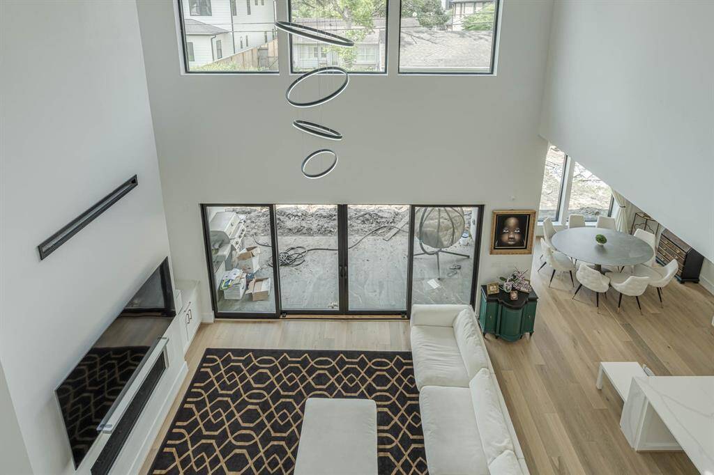 Sunlight streams through generous windows, making the living room a bright and cheerful gathering space throughout the day