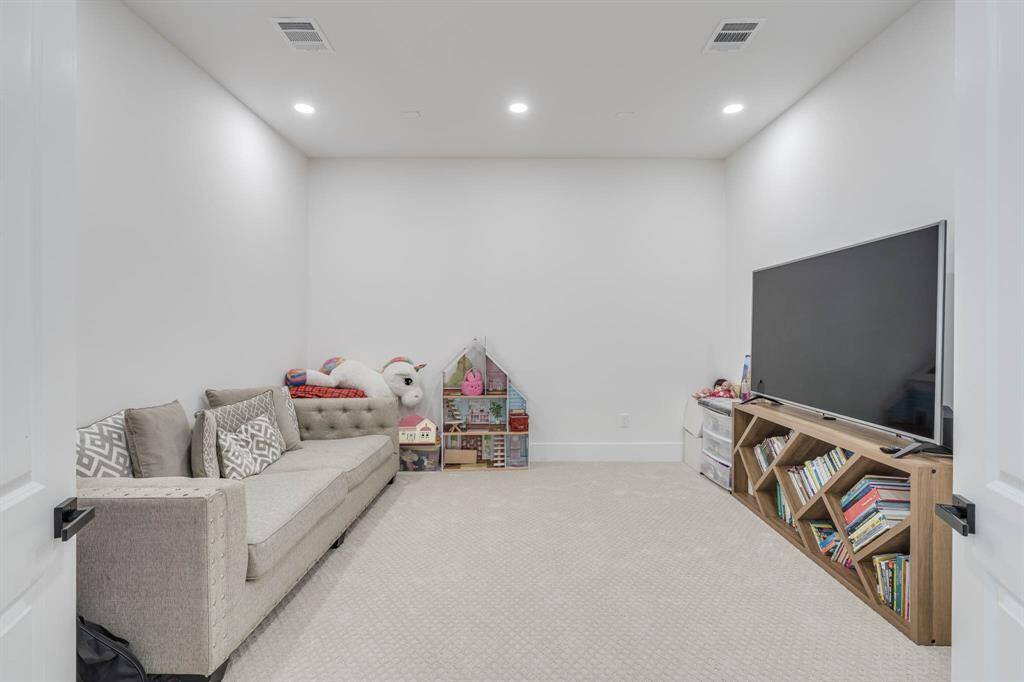the spacious media room provides the perfect spot for cozy movie nights, gaming, or watching the big game