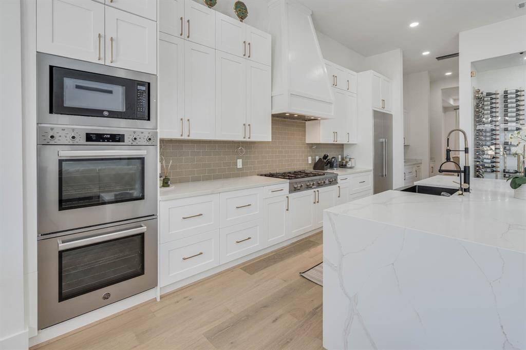 High end appliances, double ovens and gas cooktop Built in refrigerator