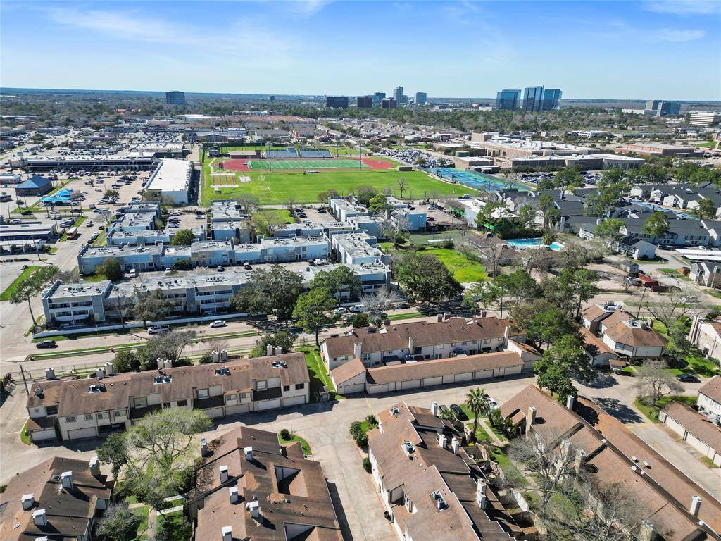 This aerial view showcases your residential area, offering a wide perspective of the neighborhood.