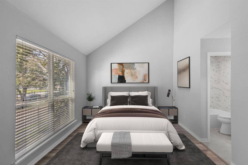 Your secondary bedroom offers a spacious and comfortable retreat, featuring a vaulted ceiling and plenty of natural light. The en-suite bathroom adds convenience, while the bright, neutral design creates a relaxing and serene atmosphere.
