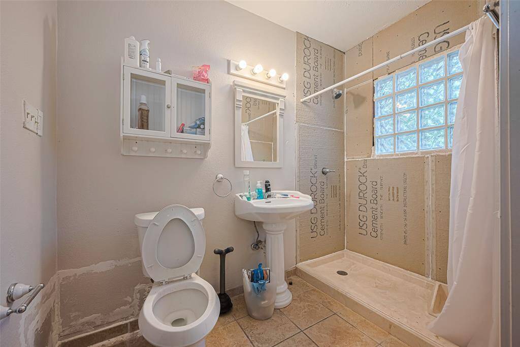 Primary ensuite features large shower incomplete, pedestal sink