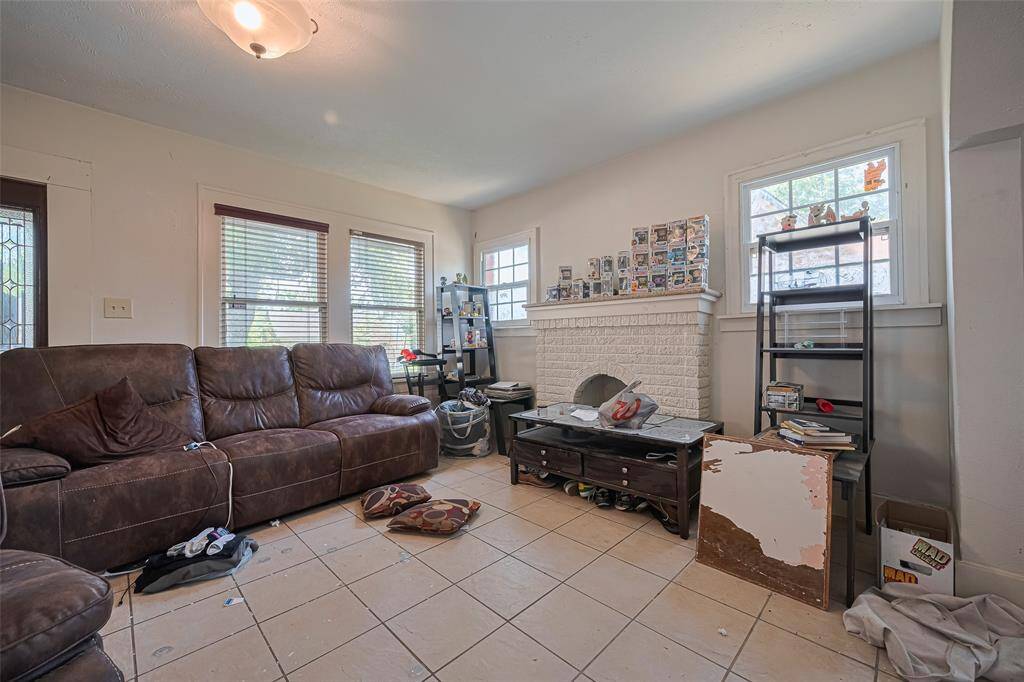 Brick fireplace adds warmth and charm to the space