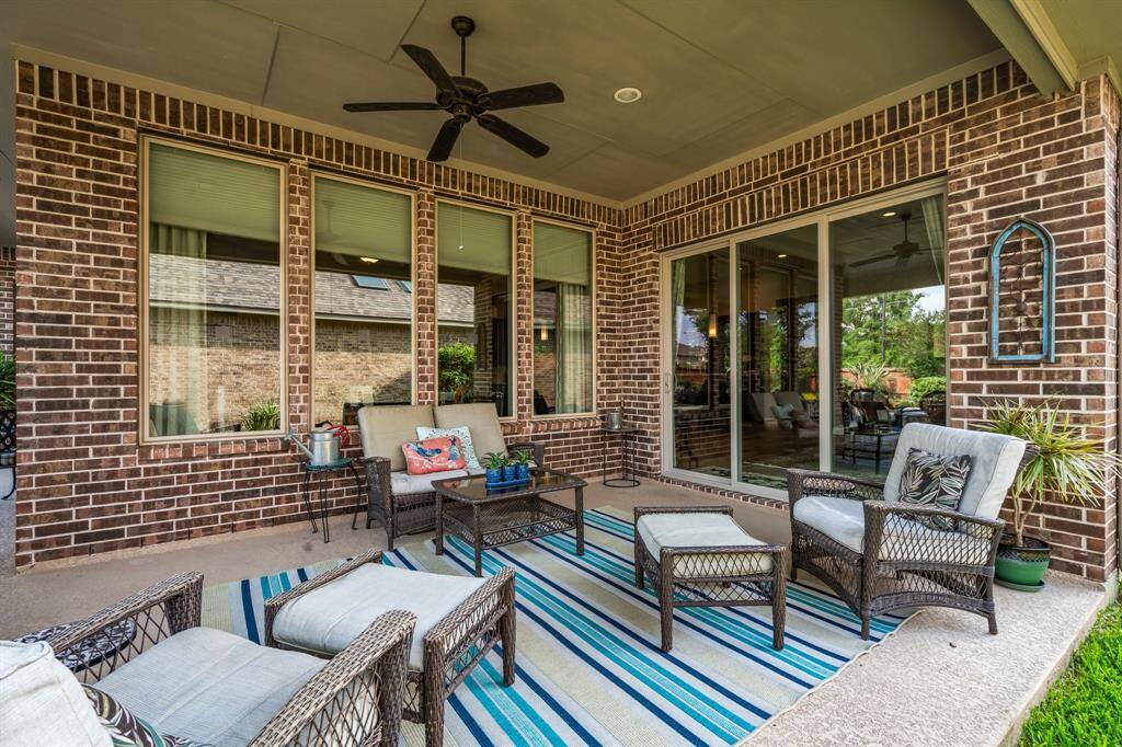 This beautifully designed covered patio offers a luxurious outdoor escape—perfect for unwinding with a glass of wine, grilling a delicious meal, or simply watching the kids splash in the pool. Featuring Kool Deck heat-reducing flooring, recessed lighting, and a ceiling fan, this space is as functional as it is inviting. With ample room for a grill and stylish outdoor furnishings, it seamlessly extends your living and dining areas into the open air, all while providing cool, shaded comfort by the pool.