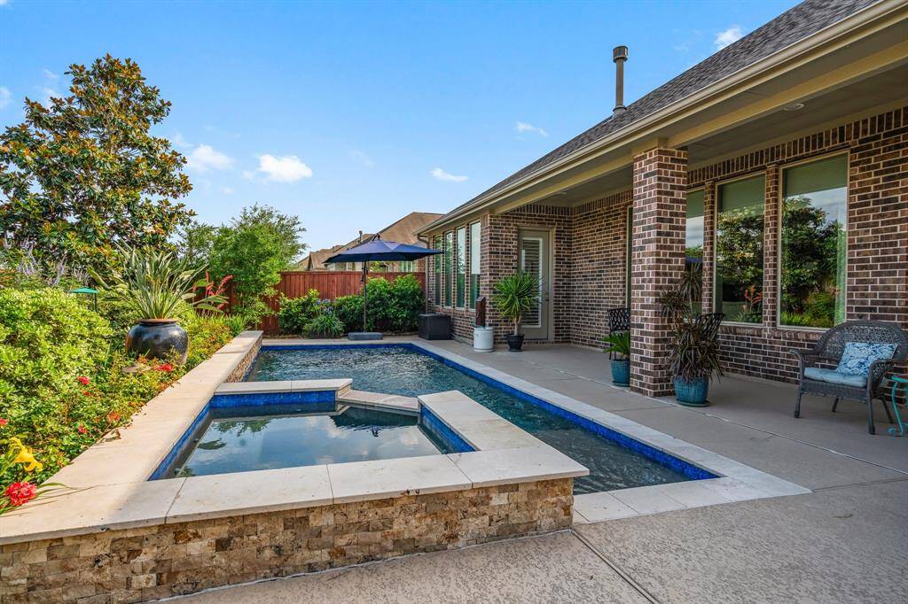 Create family memories, or entertain in style. The hot tub is perfect for Texas winters, and the pool is great for swimming laps or just a refreshing plunge after sunning. Cool off in the covered porch which is accessible from both the main living area and the Owner's suite.