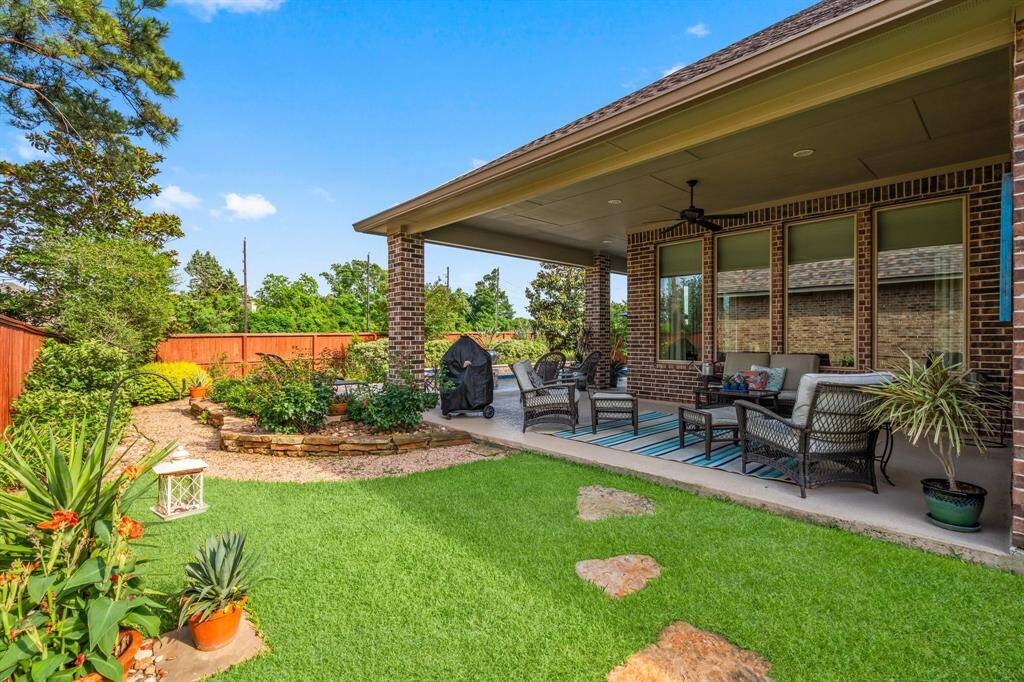 Another view of the wrap around porch and side yard. Click on the movie reel icon, or visit our on-line documents for a QR code for our walk-through video of this amazing property!