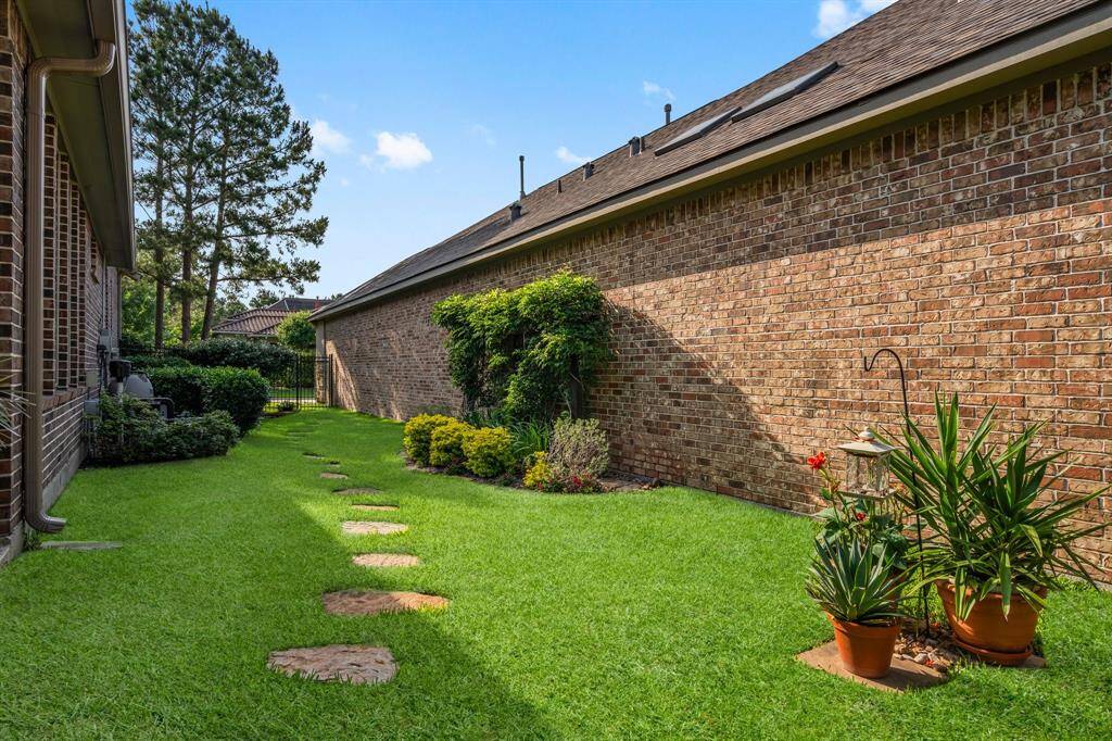 Front and rear irrigation systems ensure effortless lawn care, while seamless whole-house rain gutters provide easy rainwater management. This home is also protected with a professional exterior termite barrier treatment system, providing long-term defense against insect intrusion.