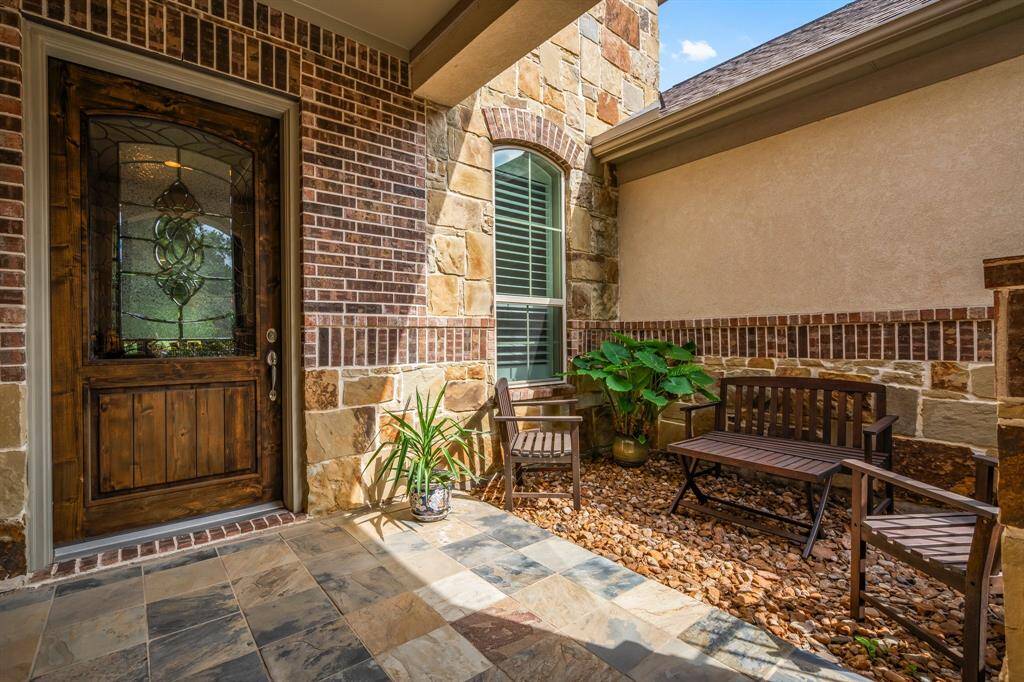 This custom-built residence is thoughtfully designed with upscale finishes and luxurious upgrades at every turn. From the moment you arrive, the elegance is unmistakable—beginning with a striking leaded glass front door that sets the tone for the sophistication found throughout.