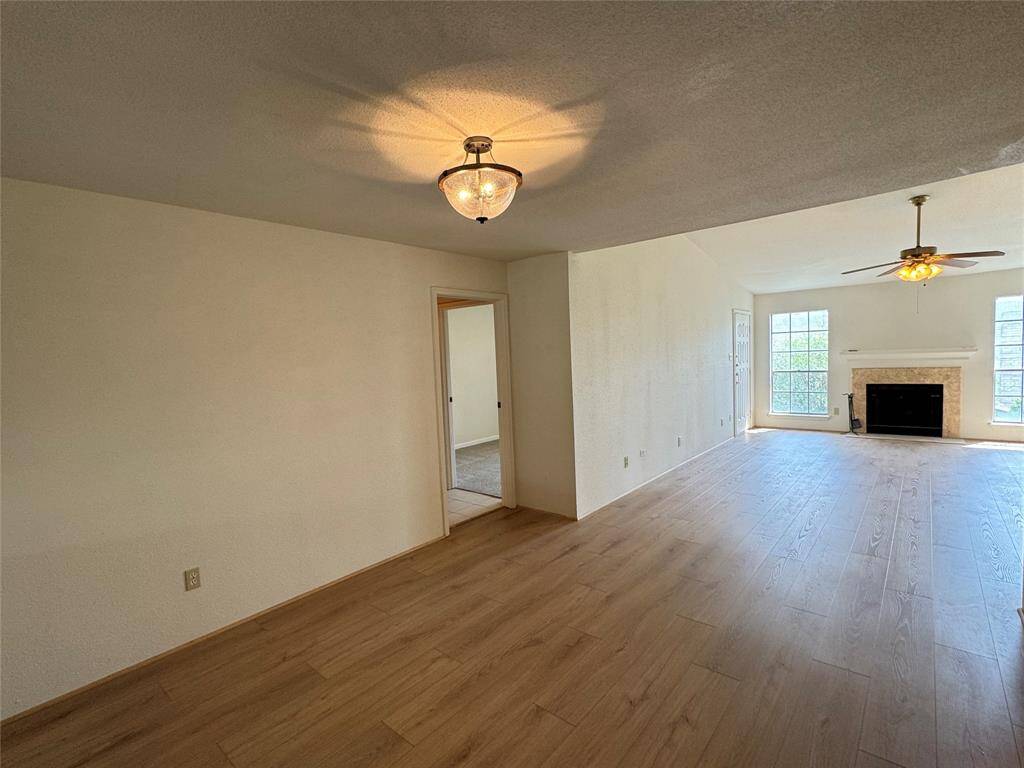Dining room view leading to secondary bedroom, bathroom, and laundry room