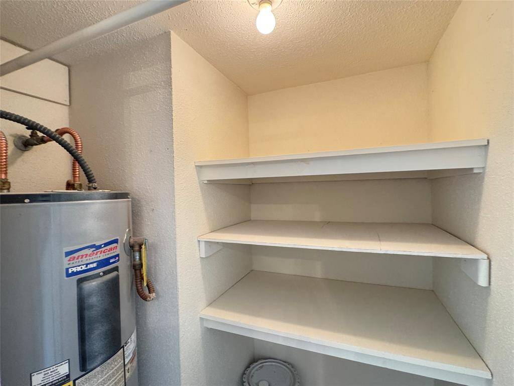 Storage closet with shelving and rod