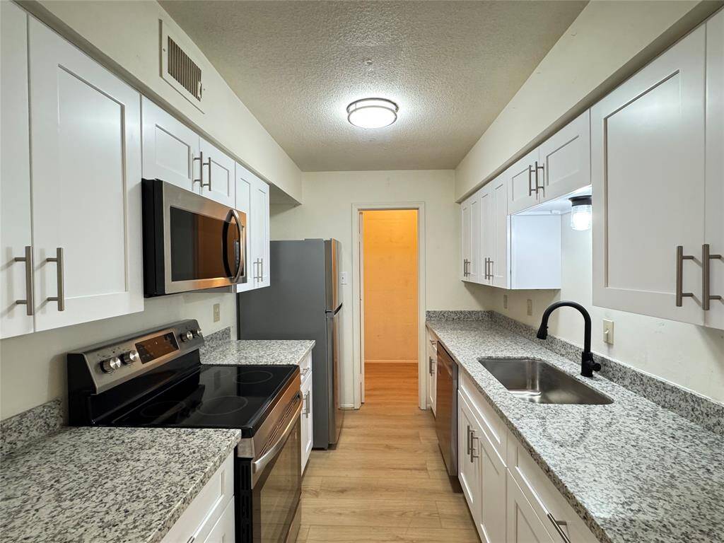 NEW shaker style cabinets, NEW granite countertop, and ALLL NEW stainless steel appliances
