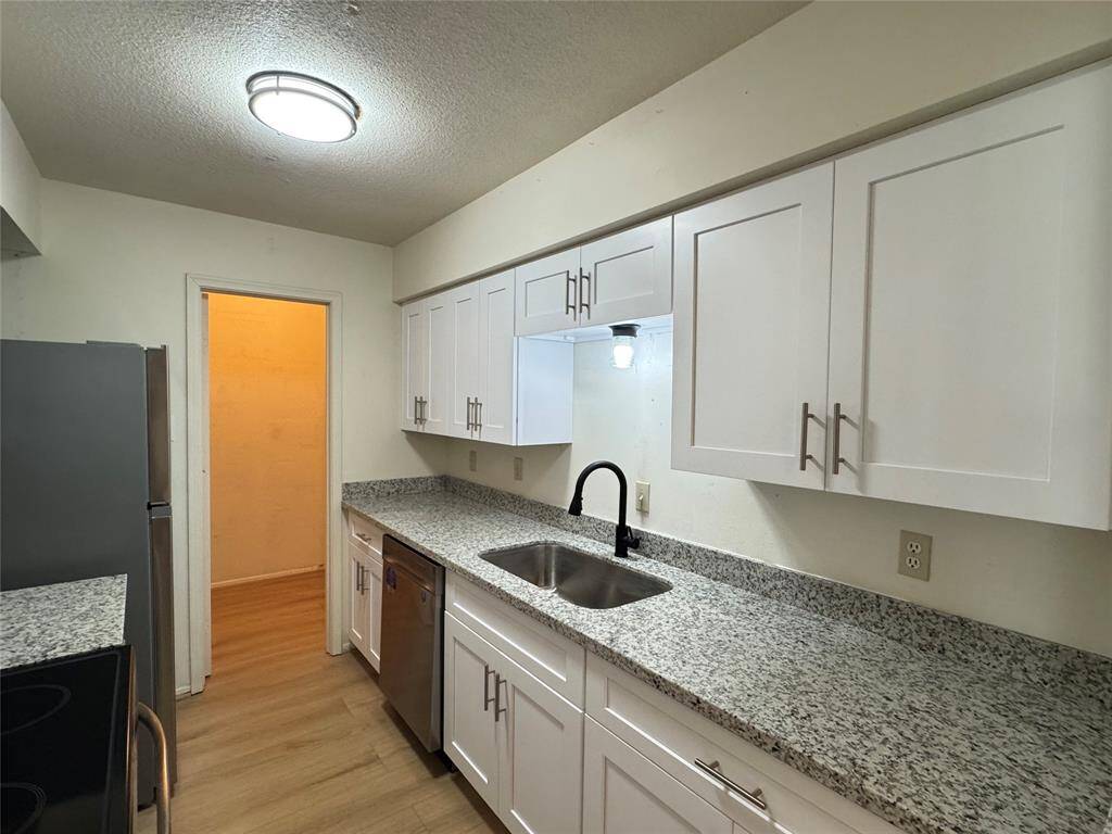 NEW plumbing fixtures and farmhouse style stainless steel sink accompanies the NEW stainless steel appliances