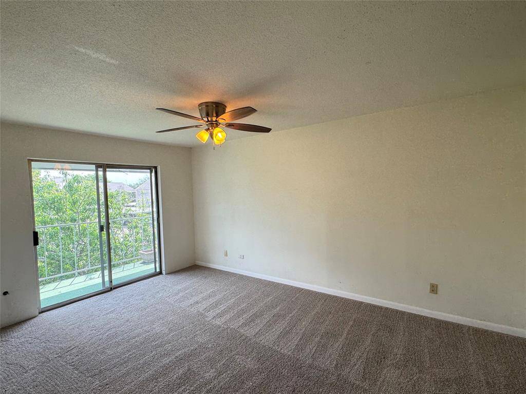 Reverse view of primary bedroom, bathroom to the left and closet on right