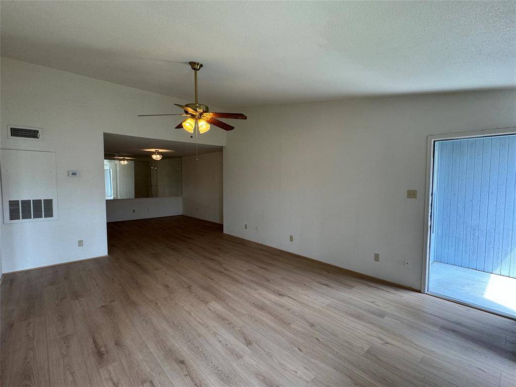 View towards the dining room, primary suite to the left
