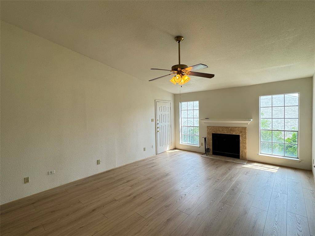 Reverse view of living room with plenty of natural light from window