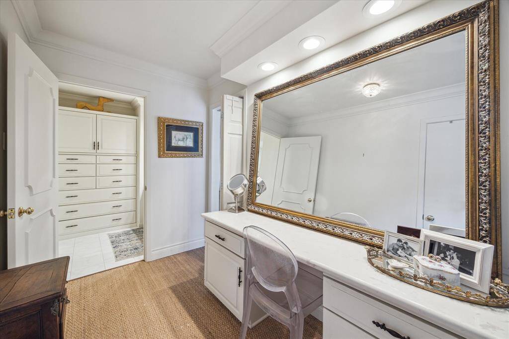 This ensuite flex/dressing room just off the primary bedroom suite affords lovely space for your morning routine.