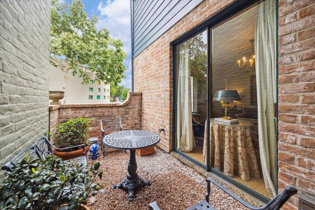 This side patio is just off the formal living room/study and is accessible from the dining room as well.