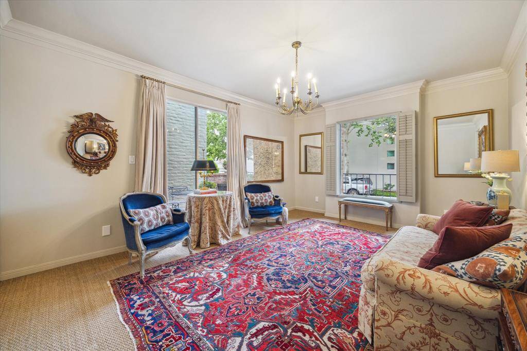 Another lovely feature of the formal living room is its  access to one of the ground floor patios (viewed through the glass doors on the back left  in this picture).