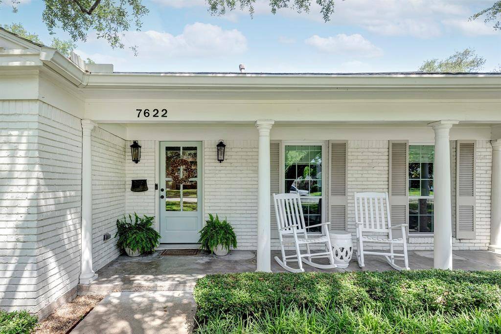 Inviting front porch with updated door and windows, plus a view of the neighborhood.