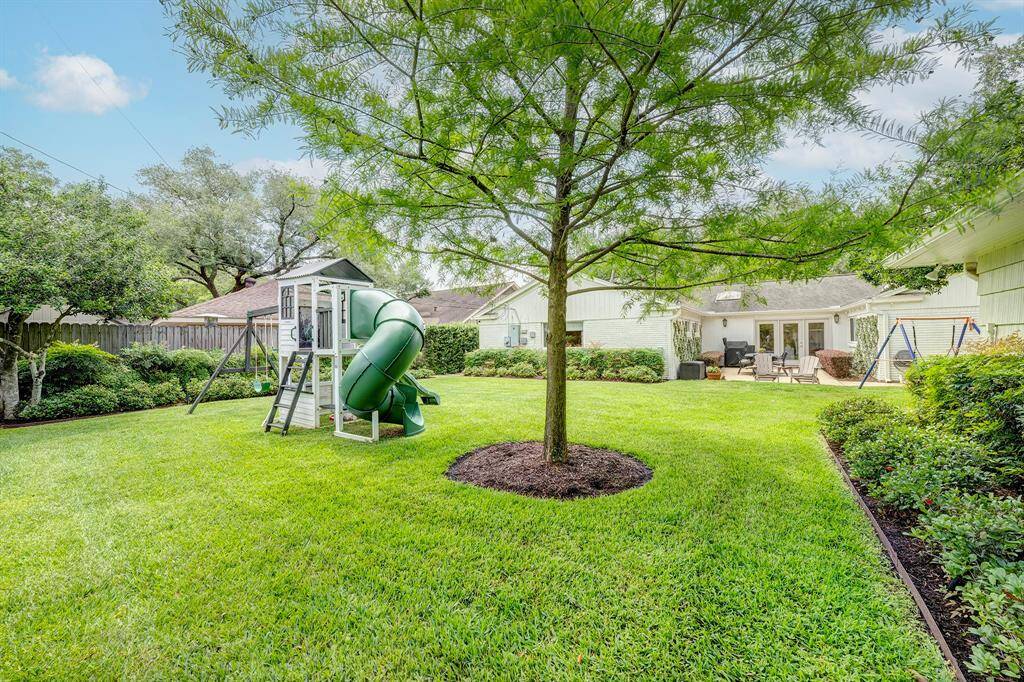 Another view of the spacious yard looking towards the house.