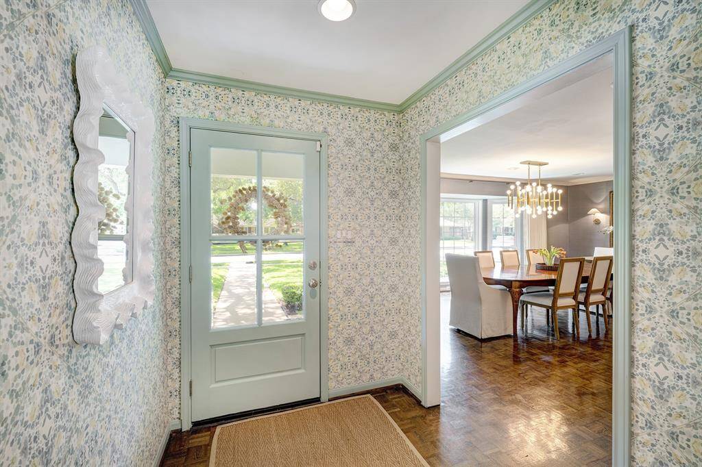 The welcoming entry with opening to the spacious dining room on the right.