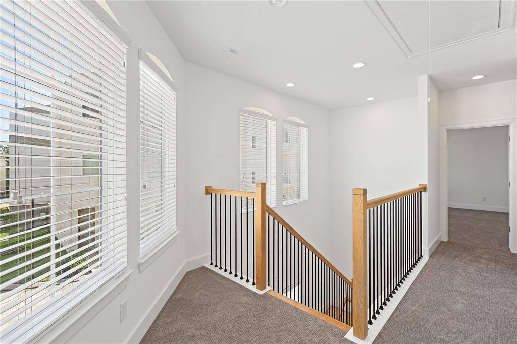 Stairs leading up to second floor. BRAND NEW CARPET THROUGHOUT the bedrooms.