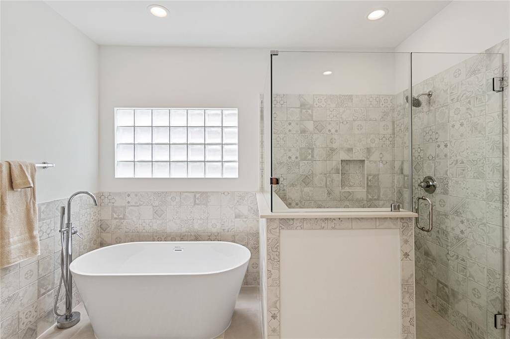 Primary bathroom floating bathtub and standing shower!