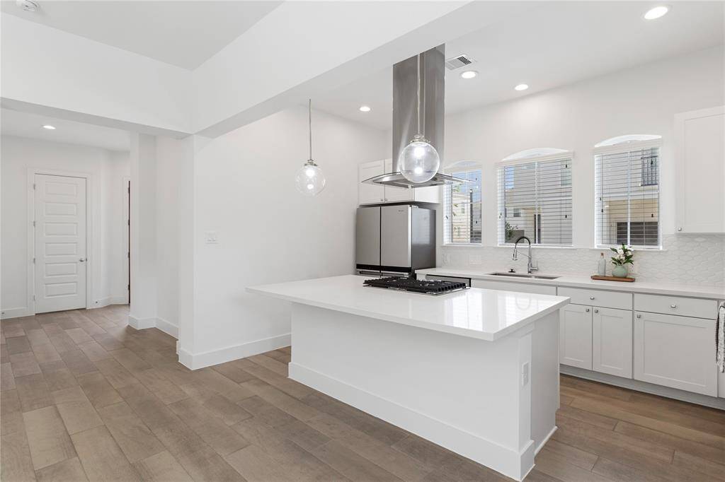 Three beautiful windows in the kitchen allowing a ton of natural light.