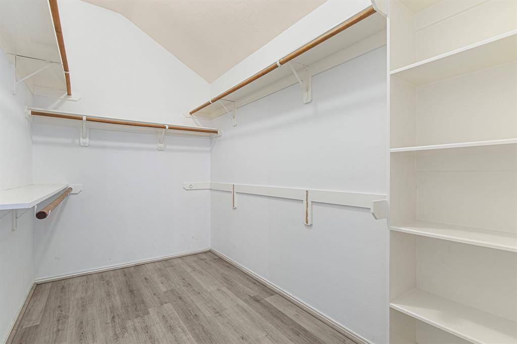 Walk-in closet with built-on storage.