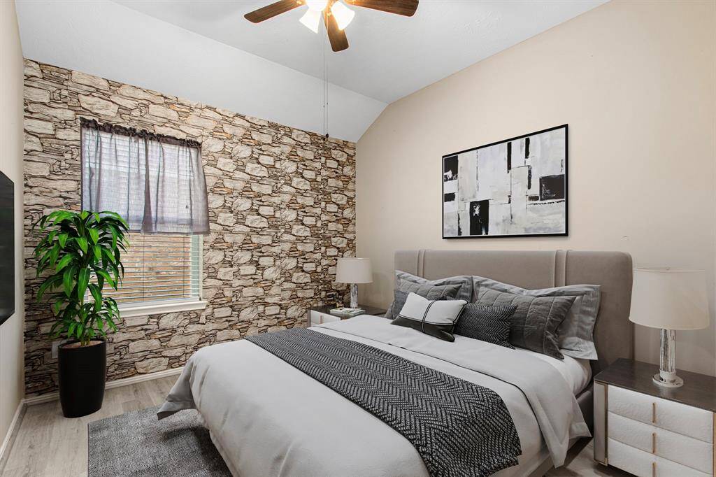 Bedroom #2. Accent wall is peel-and-stick and can be removed at the request of a Buyer.