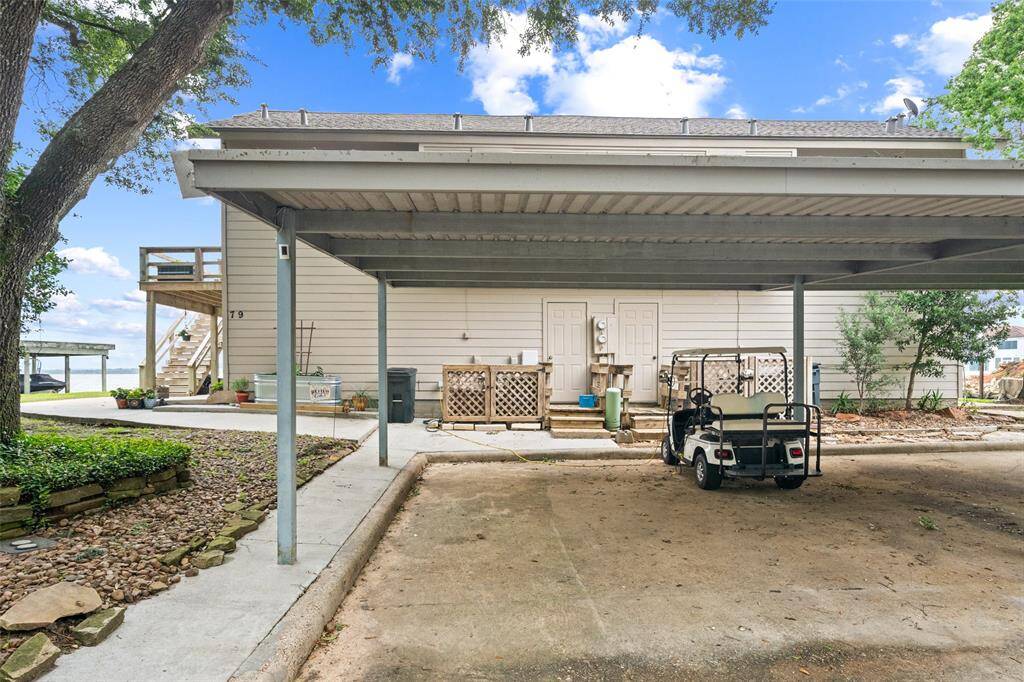 2 covered parking spots. *Golf Cart not included*