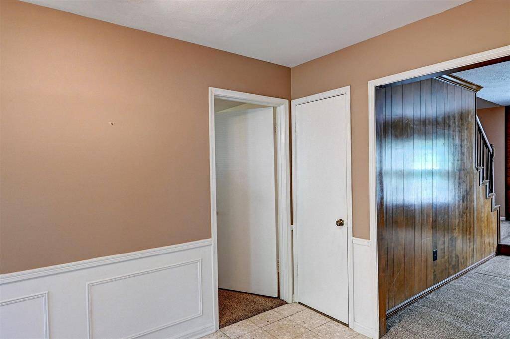 Entry way with tile flooring. This space is simple and functional, ideal for access to different areas of the home.