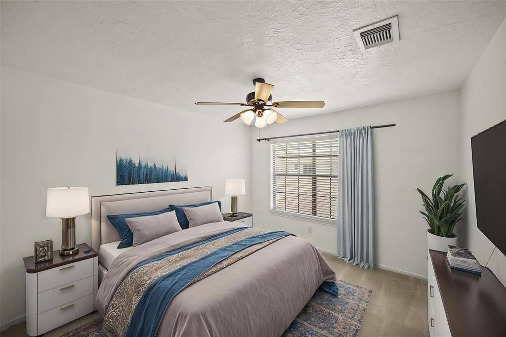 Your second bedroom offers a generous and inviting space that exudes comfort and versatility. - virtually staged