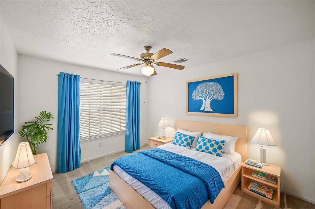 The thoughtfully designed layout of your third bedroom allows for natural light to flood the room, creating a warm and welcoming atmosphere. - virtually staged