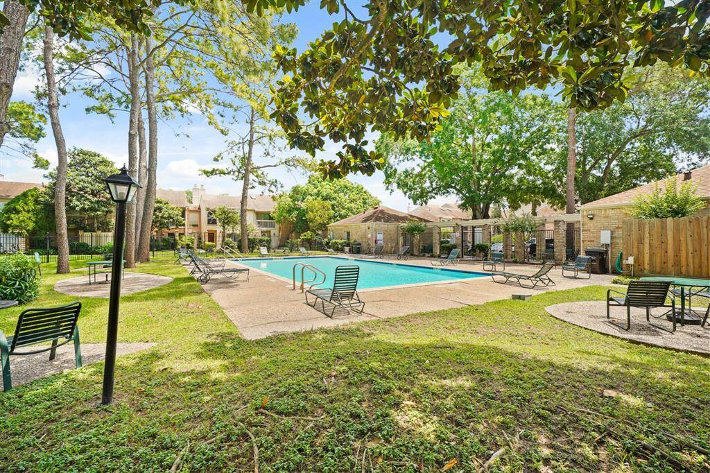 The community pool provides a refreshing escape, offering a perfect spot to relax, swim, or socialize with neighbors on warm days.