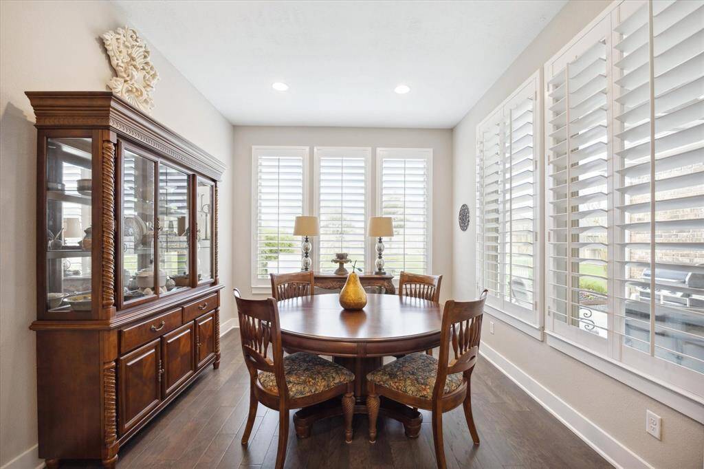 Expansive dining area fits a china cabinet, side table, and oversized dining table with ease.