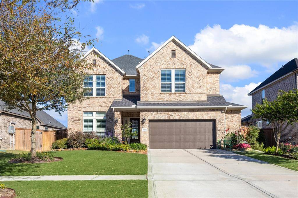 Spacious double-wide driveway for ample parking.
