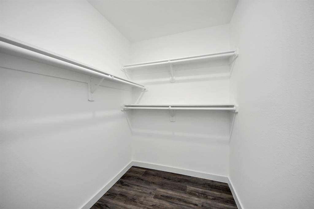 Third bedroom features recessed lighting and a large window.